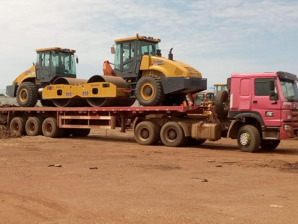 Two XCMG vibratory rollers loaded on a flatbed trailer